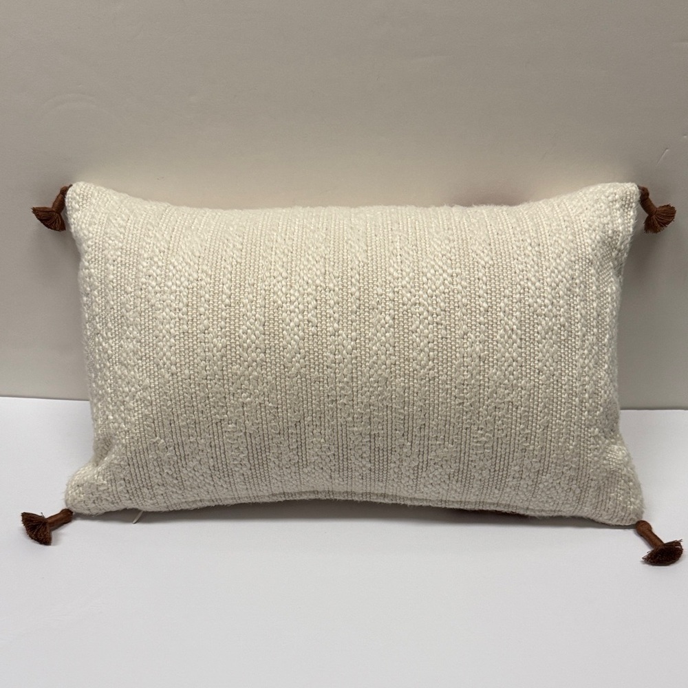 Textured Cream Throw Pillow with Rust Accent and Tassels - Picture 2 of 5